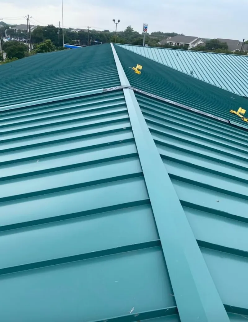 Green commercial metal roof ridge and valley for Metal Roof Repair in Glens Falls